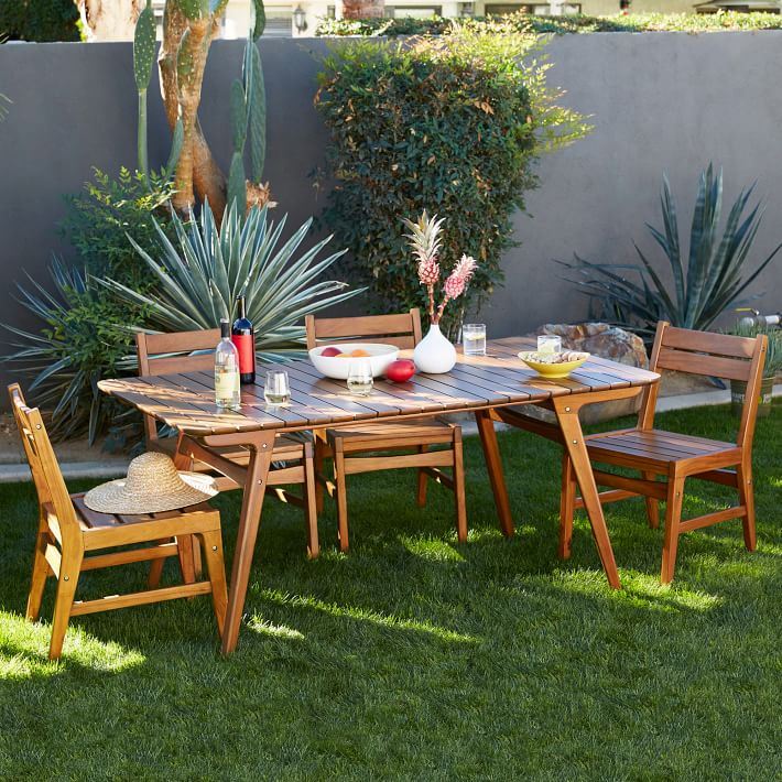 Outdoor dining area surrounded by plants