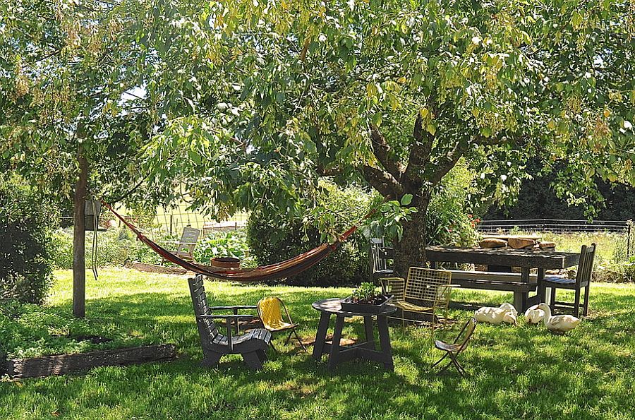 Perfect outdoor escape with dining area and a cool hammock hangout [Design: Luci.D Interiors]