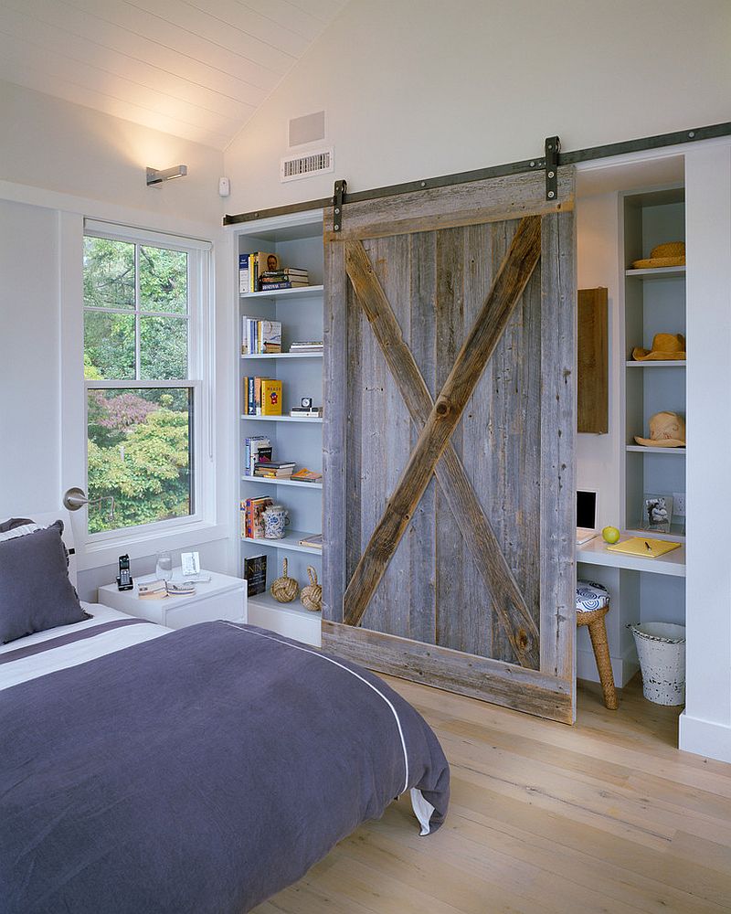 Reclaimed barn wood door for the bedroom shelf and office nook [Design: Hutker Architects]