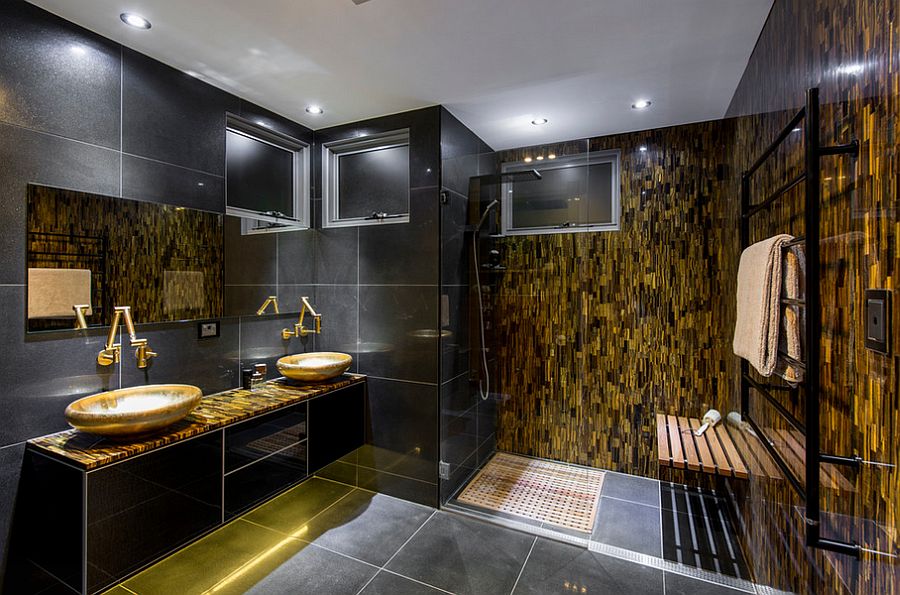 Red Tigers Eye stone feature wall adds gold to the glam bathroom [From: Enigma Interiors]