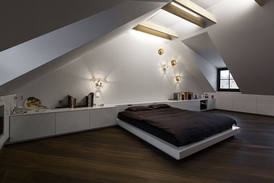 Santed ceiling adds a unique appeal to the stunning attic bedroom