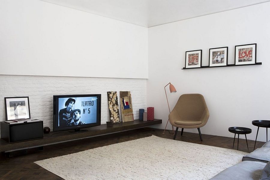 Sleek entertainment unit inside the apartment has a minimal, modern style