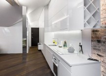 Sleek-kitchen-workdstation-in-white-makes-smart-use-of-space-217x155