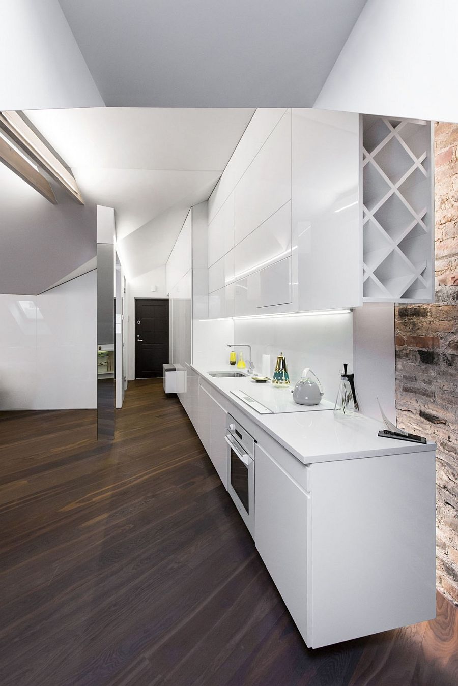 Sleek kitchen workdstation in white makes smart use of space