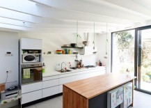 Sleek-kitchen-workstation-in-white-and-wooden-island-217x155