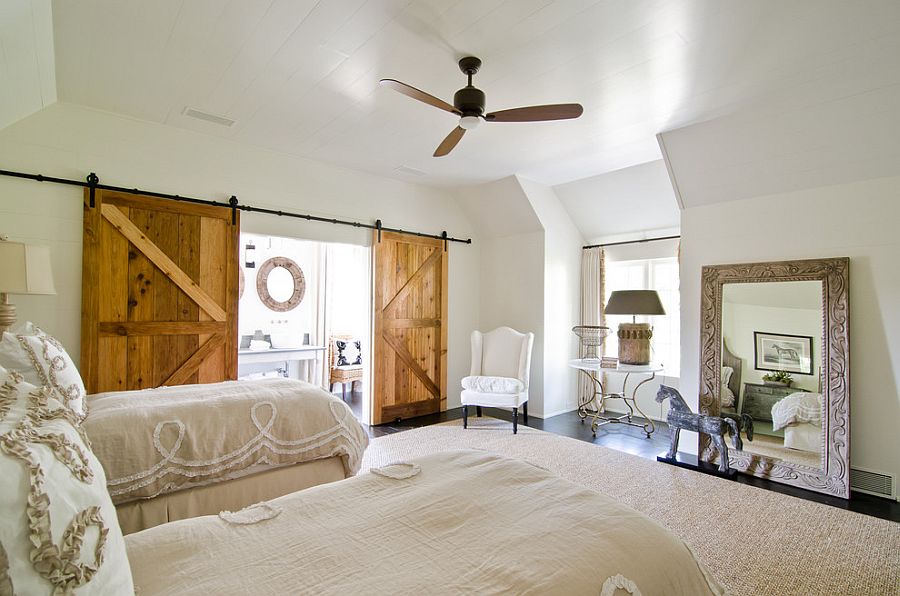 Sliding barn doors add texture to the cool bedroom