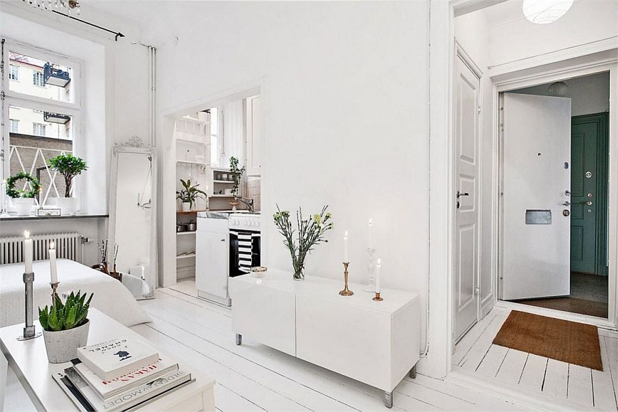 Small living area of the apartment in white with ample natural light