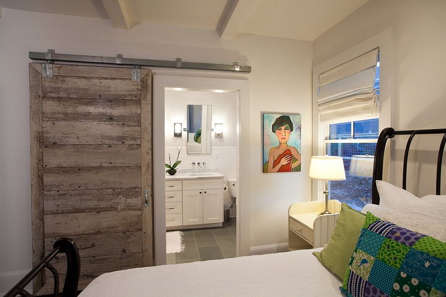 Smart barn door saves up space in the small bedroom [Design: Nathan Cuttle Design]