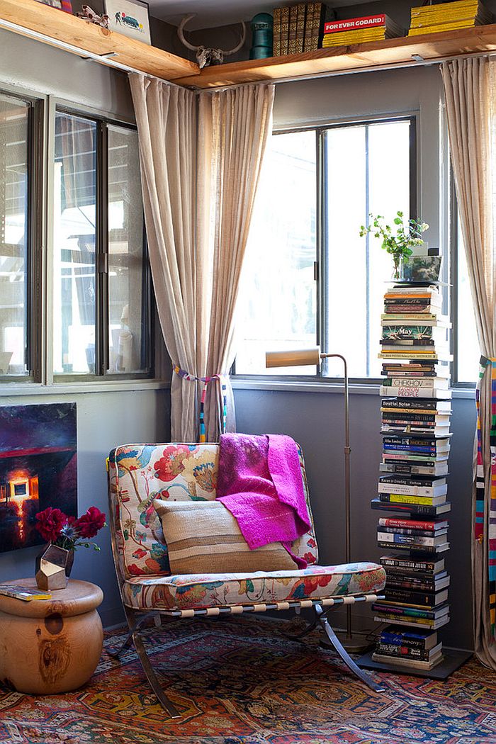 Smart way to stack up the books in the reading nook [Design: Kimberly Stevens / Photography by Teri Lyn Fisher]