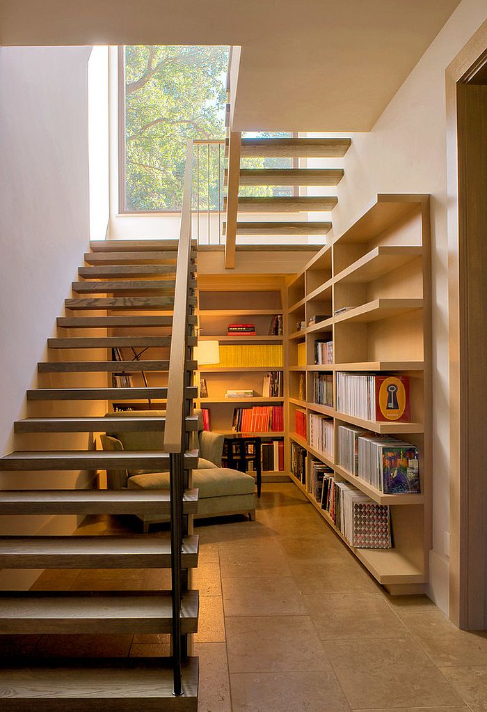 Space under the staircase is used as a reading nook [Design: Total Concepts]