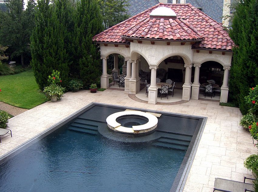 Stamped concrete pool deck is both aesthetic and durable [Design: Harold Leidner Landscape Architects]