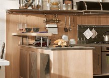 Steel-worktop-and-wooden-cabinets-shape-the-kitchen-workstation-217x155