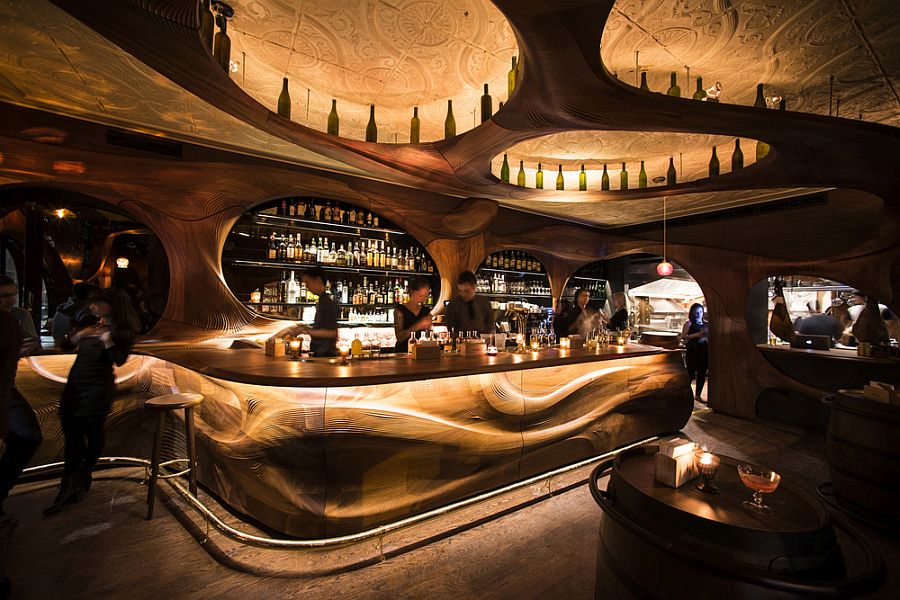 Stunning interior of Bar Raval Toronto draped in CNC'd mahogany