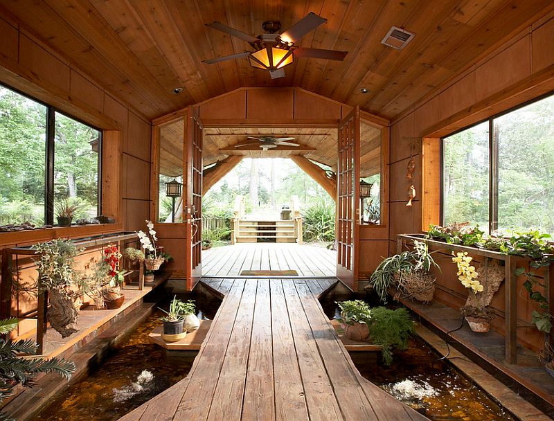 Stunning pond at the entry brings the outdoors inside [Design: Vacation Home Builders]