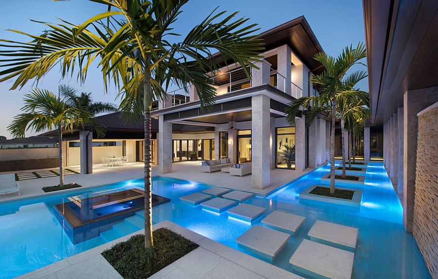 Stunning pool with precast concrete pool deck and stepping stones [Design: Harwick Homes / Giovanni Photography]