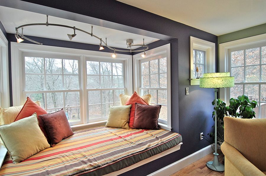 Track lighting adds beauty to the cozy window seat [From: Brenda Olde Photography]