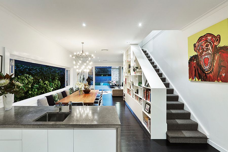 View of the contemporary dining room and bookshelf wall