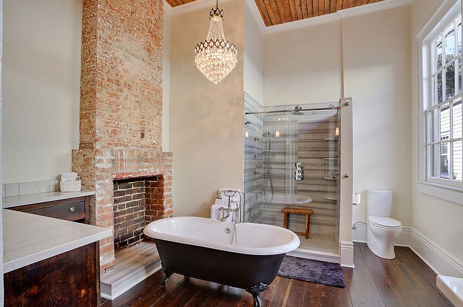 Vintage French chandelier adds glam to the transitional bathroom