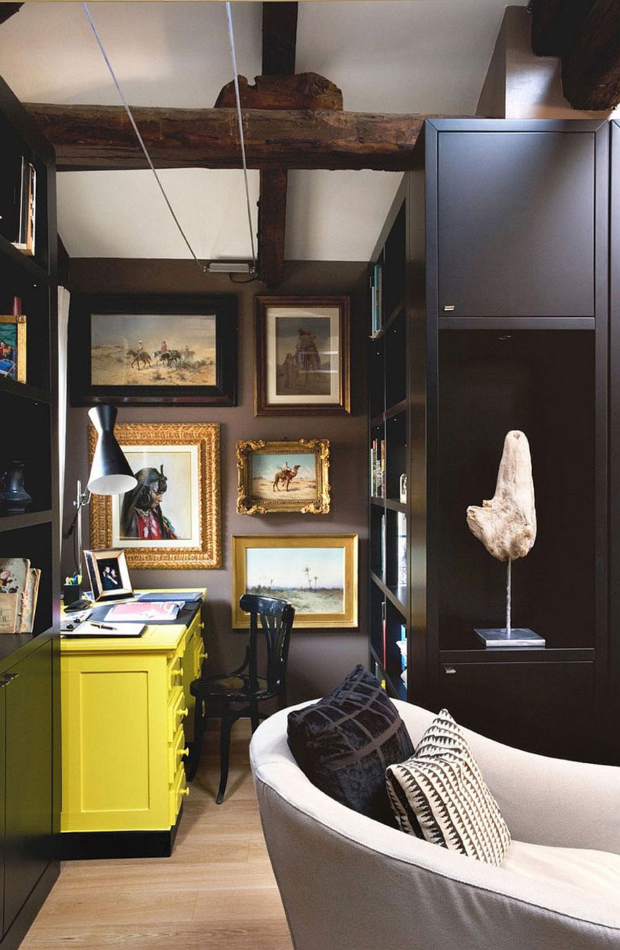Wall art steals the show in the small, dark home office