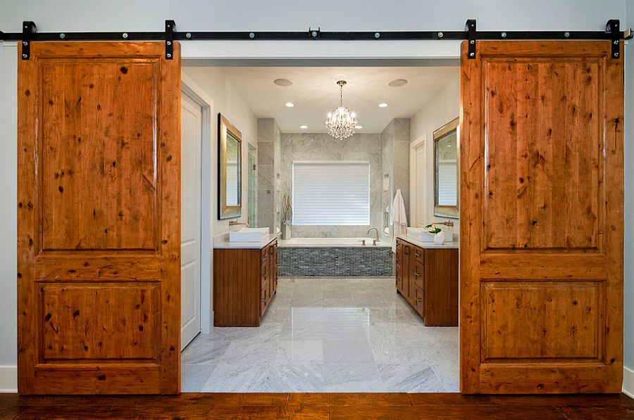 Barn doors bring rustic simplicity to the modern bathroom