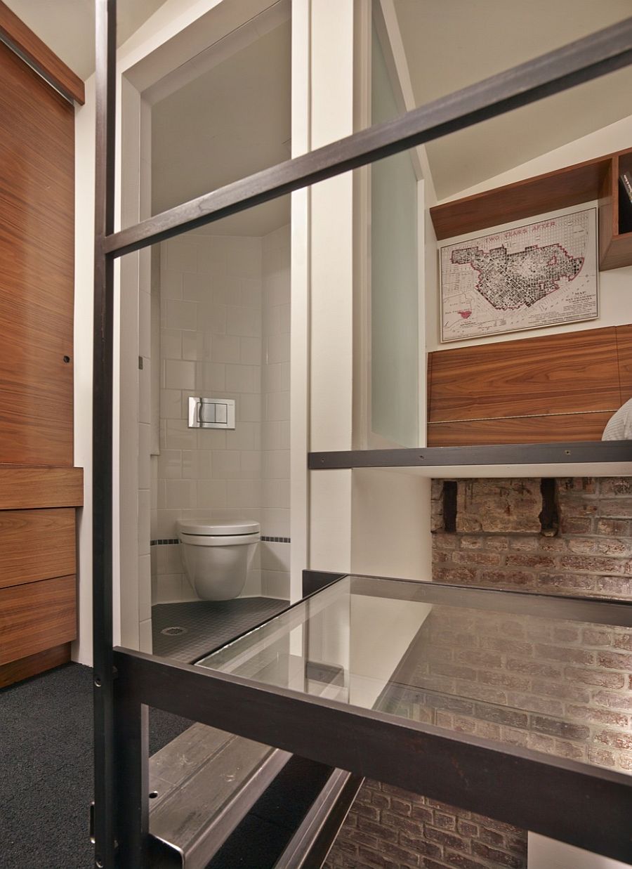 Bathroom and glass landing area leading to the loft bedroom