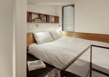 Bed-loft-with-additional-display-and-storage-space-in-the-tiny-guest-house-217x155