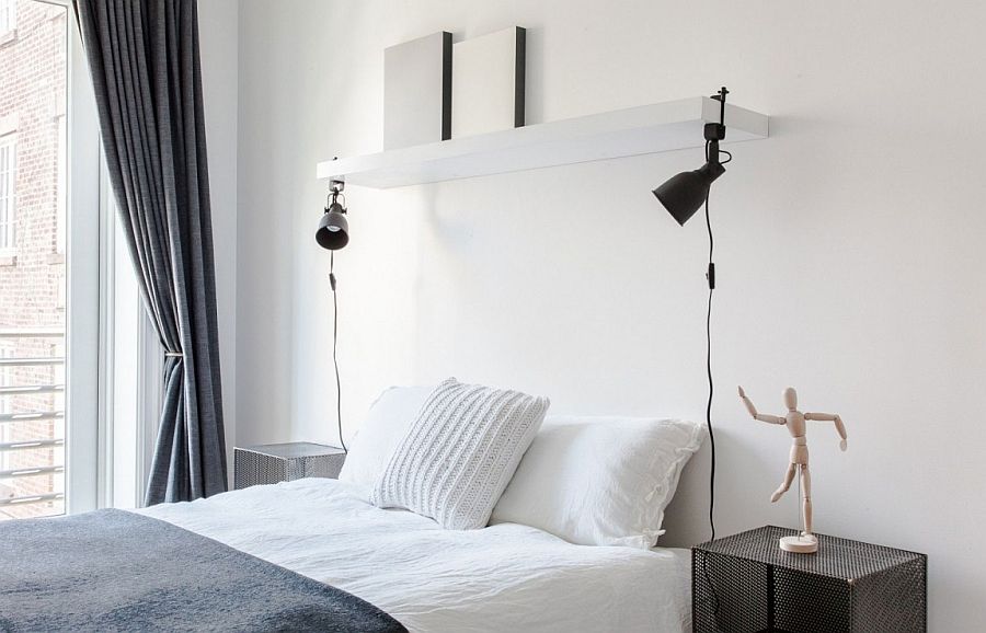 Bedside table and lighting bring symmetry to the relaxing bedroom