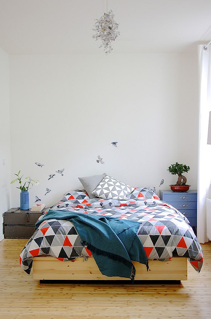 Bird decal in the backdrop steals the show in this classy bedroom