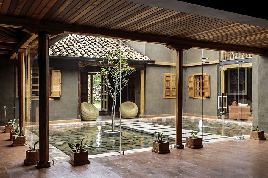 Central courtyard of the home with a reflective pond and walkway