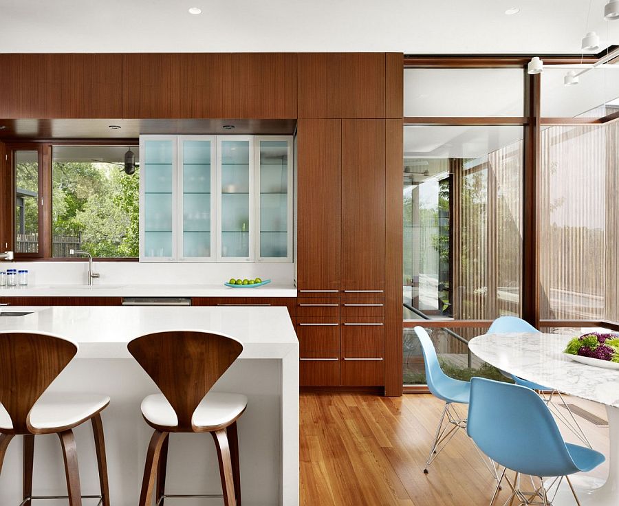 Classic Cherner bar stools in the kitchen give it midcentury glam