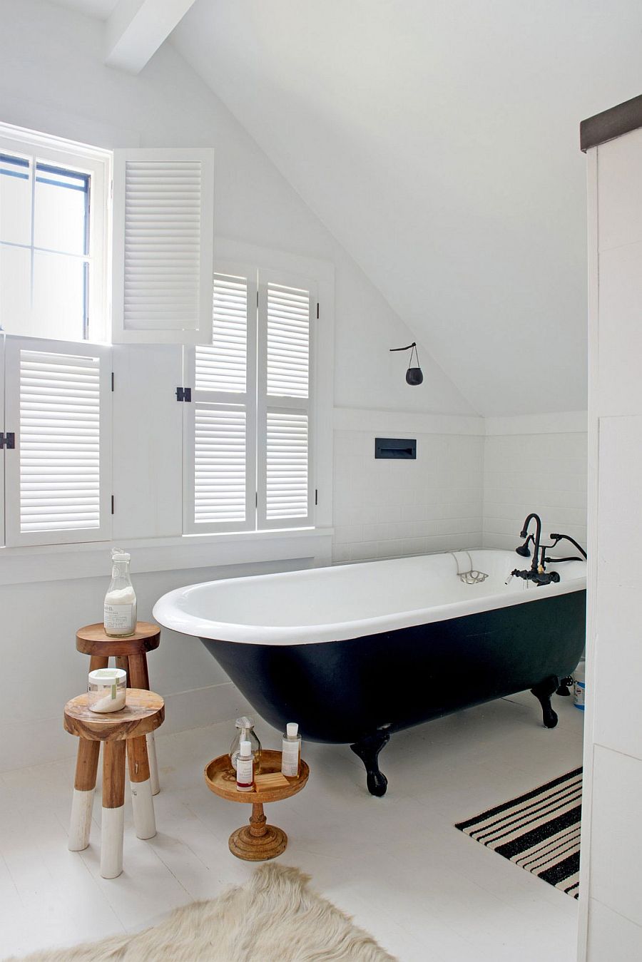 Claw-foot bathtub in the small bathroom in black and white