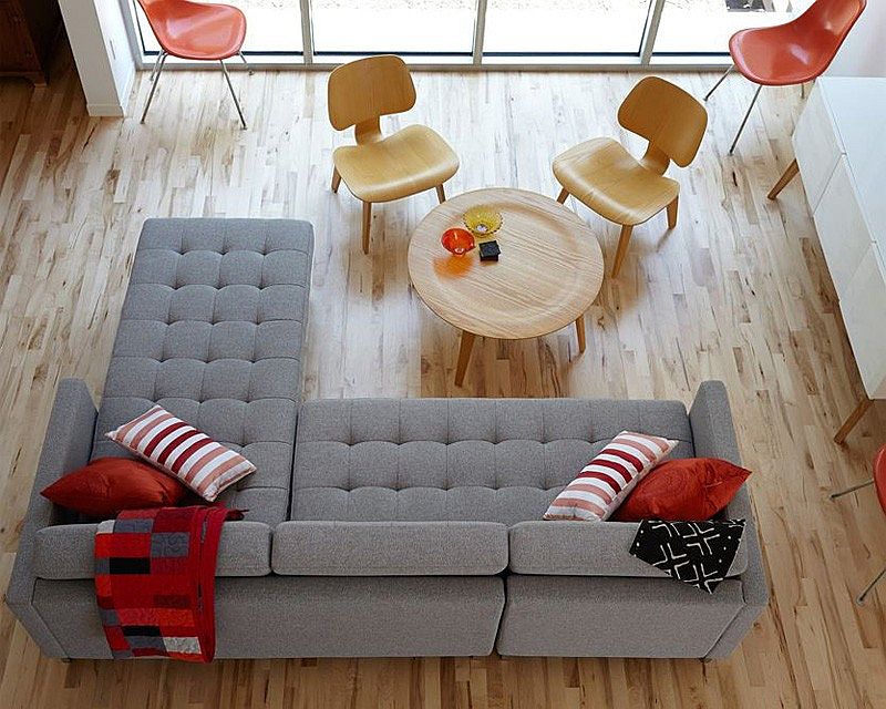 Cozy gray couch with red accents in the living area
