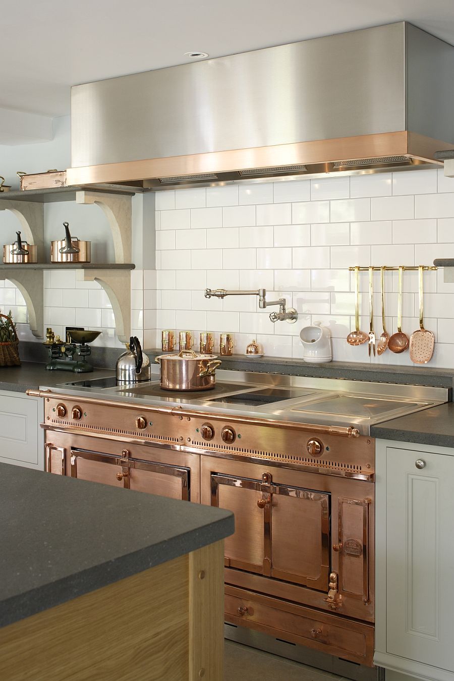 Custom copper and stainless steel La Cornue range in the bespoke kitchen