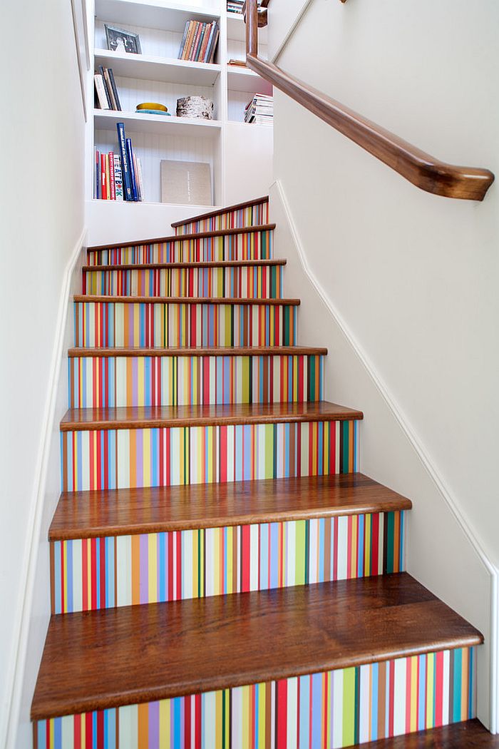 Custom multi-color striped wallpaper enlivens the stairway