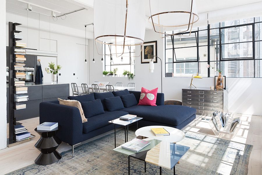 Dark blue couch becomes the focal point in the Scandinavian living room