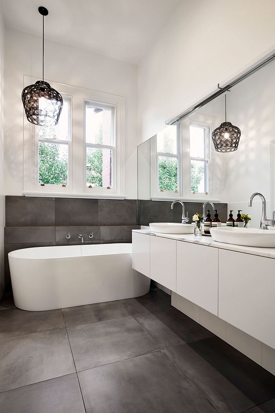 Fabulous bathroom design with pendant lighting and standalone bathtub