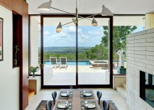 Formal-dining-area-of-the-Lake-View-Residence-connected-visually-with-the-pool-deck-outside-217x155