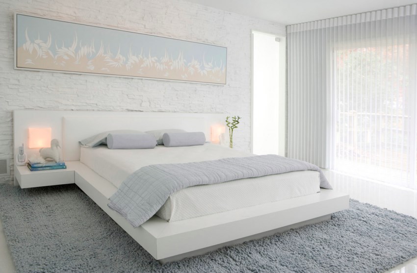 Gauzy white curtains in a modern bedroom