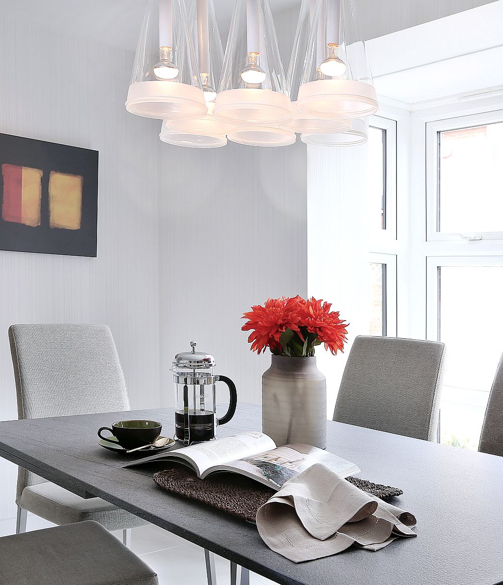 Gorgeous Fuchsia pendants and cool color palette shape the dining room