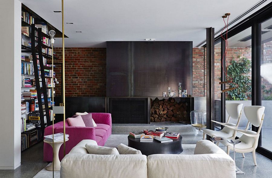 Gorgeous use of color and texture in the elegant living room with brick wall