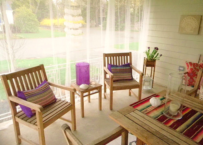IKEA curtains provide mosquito protection on this porch