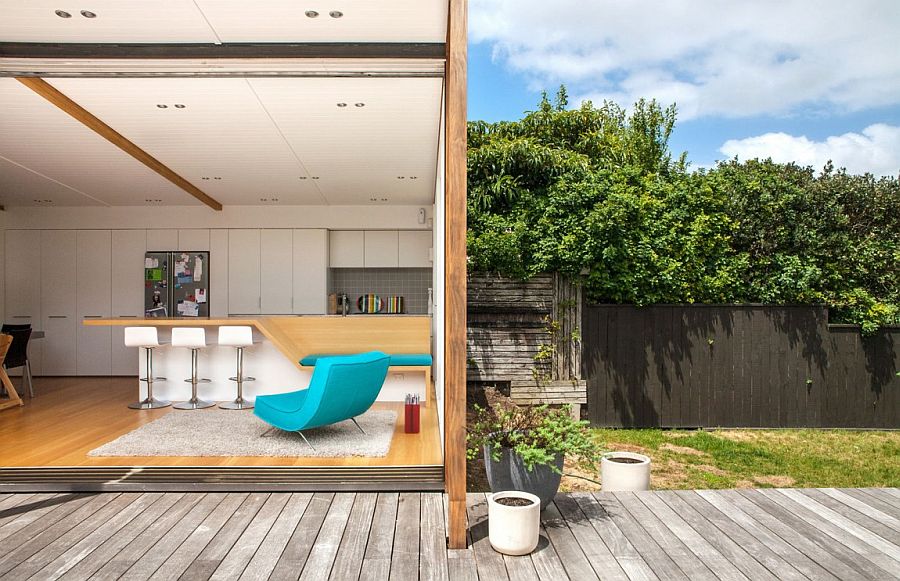 Kitchen and dining area additions that visually extend into the backyard