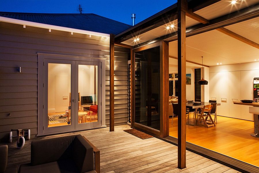 Lighting inside the house adds to the ambiance of the deck