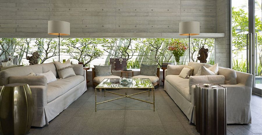 Living room with expansive window that brings the garden greenery indoors