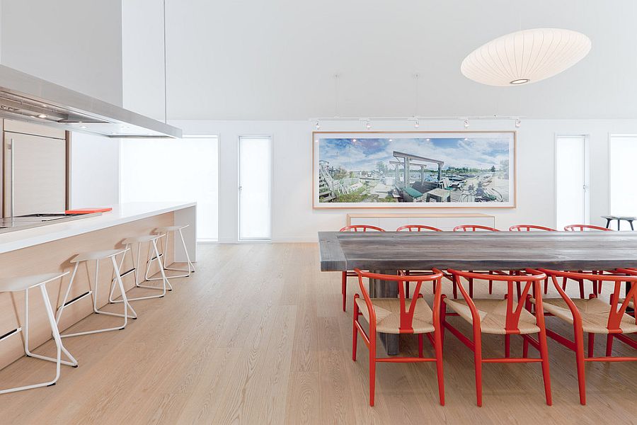 Lovely pendant light above the dining table blends in with the color scheme