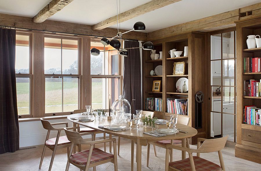 Lovely use of books to decorate the farmhouse dining room [Design: David Nelson & Associates]