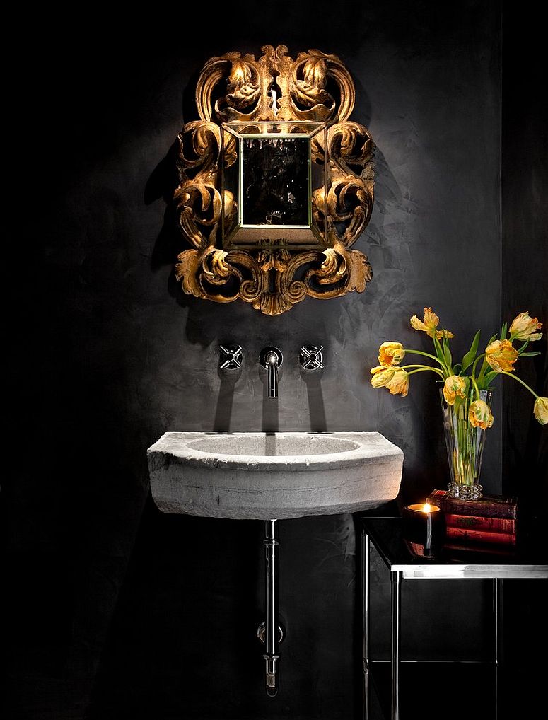 Mediterranean powder room with a black backdrop and stone sink