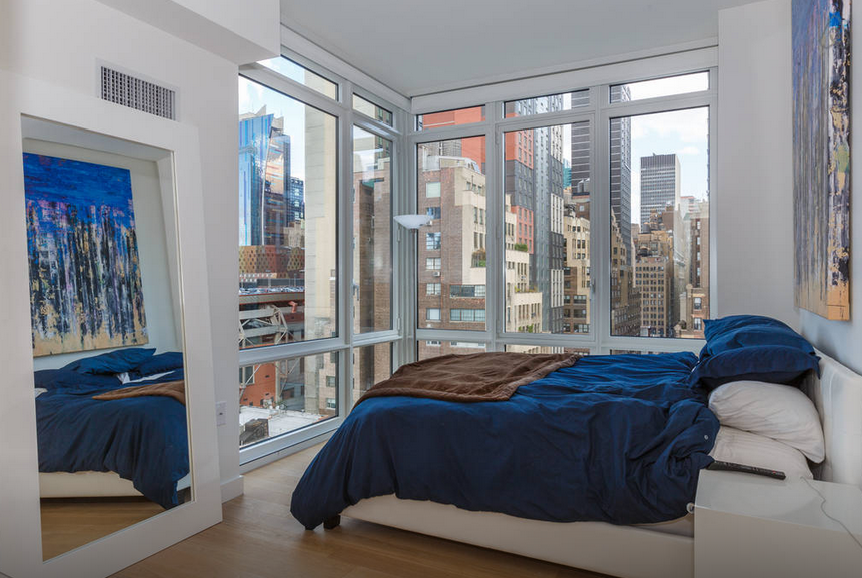 Midtown Manhattan Penthouse Bedroom with Blue Accents