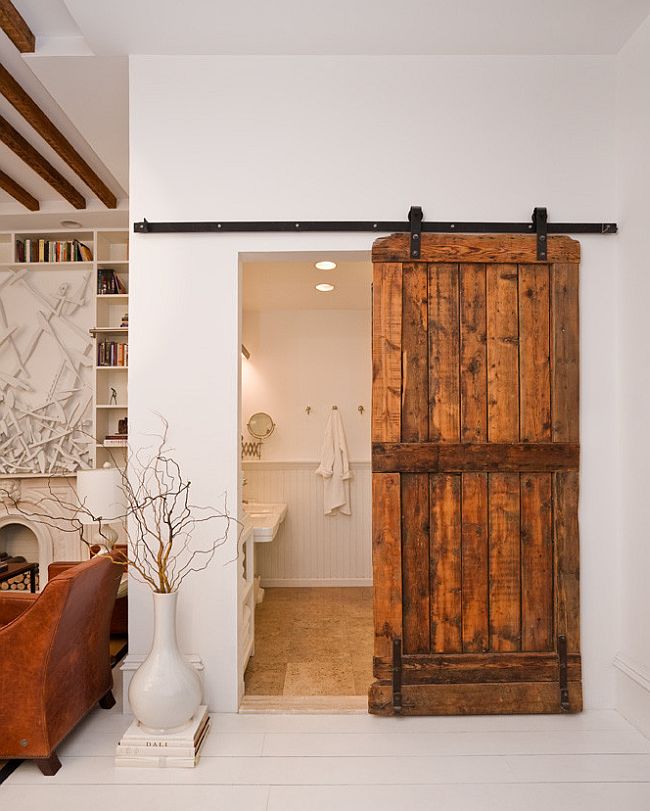 Modern eclectic bathroom with a lovely barn door [Design: The Brooklyn Home Company / Emily Gilbert Photography]