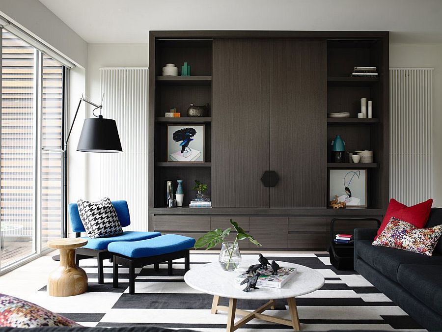 Neutral color palette of the living room with bright blue and red accents